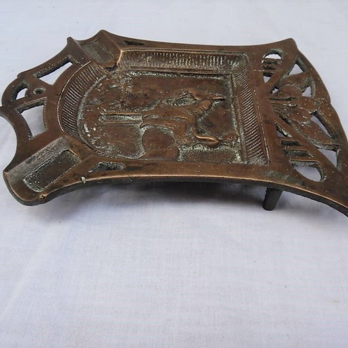 Large solid brass carved ashtray with embossed figure