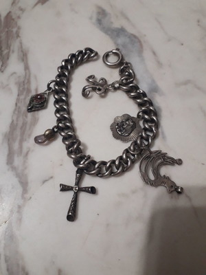 Vintage bracelet like new with silver hanging charms