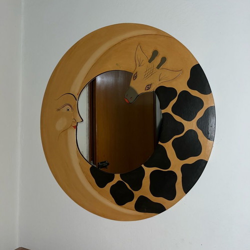 Round mirror with moon and giraffe design