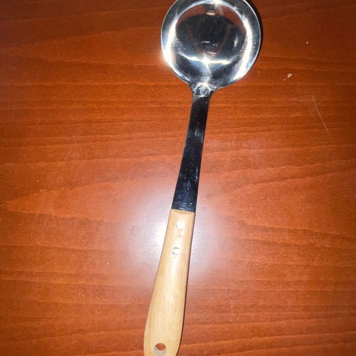 Stainless steel serving ladle with wooden handle