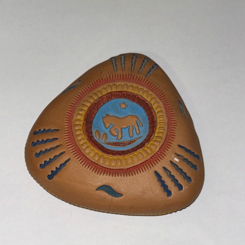Vintage decorative clay paperweight with ethnic embossed designs, like new