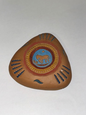 Vintage decorative clay paperweight with ethnic embossed designs, like new
