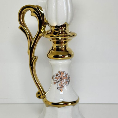 Ceramic candlestick with gold details and floral cross design