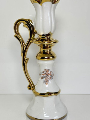Ceramic candlestick with gold details and floral cross design