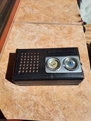 Signal 402 portable Soviet radio with clock used
