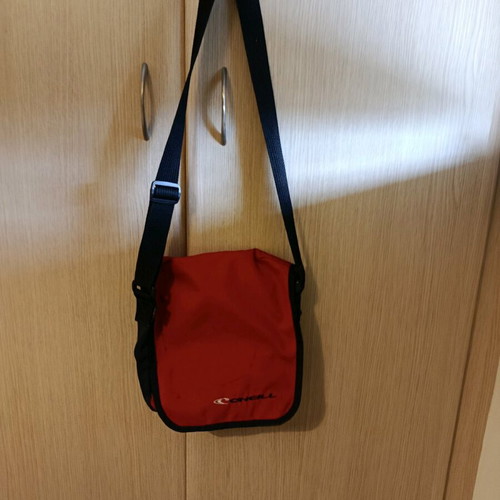 O'Neill crossbody bag used red with scratch and zipper pocket