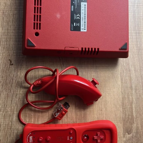 Nintendo Wii Mini console with 2 red controllers