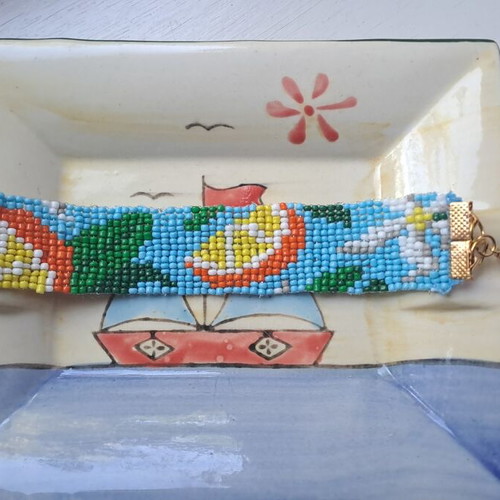 Handmade women's bracelet new with design, blue and yellow