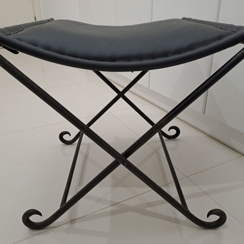 Leather footstool like new, black with cast iron frame