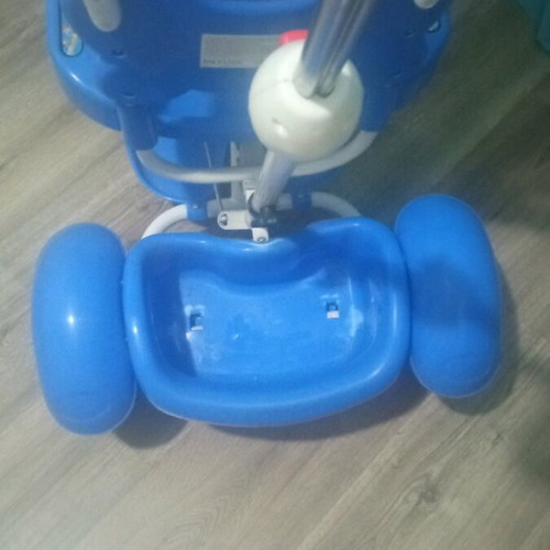 Baby blue tricycle used with canopy, storage, and adjustable parent handle