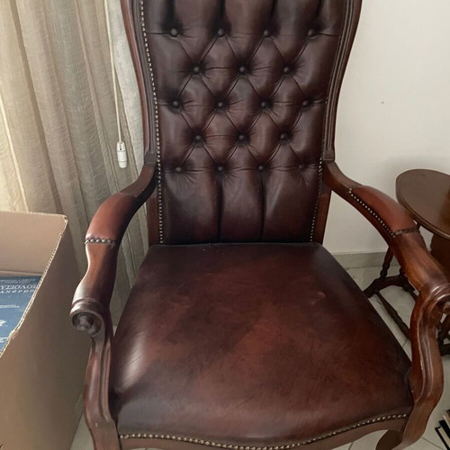 Armchair made of solid wood, leather