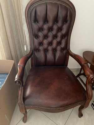 Armchair made of solid wood, leather