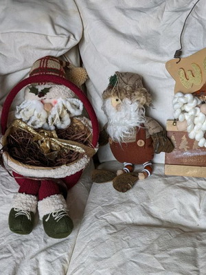 Christmas decorations used with Santa figures and baskets
