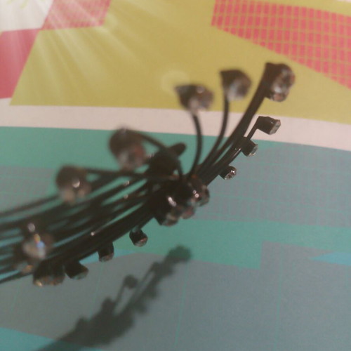 Hair comb with rhinestones and decorative design