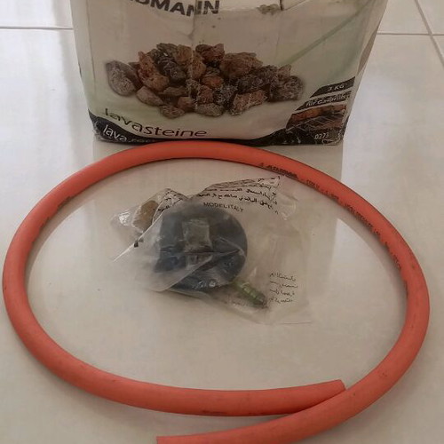 Gas grill set new with lava rocks, valve and hose