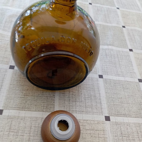Don Julio Anejo tequila round collectible bottle, amber glass