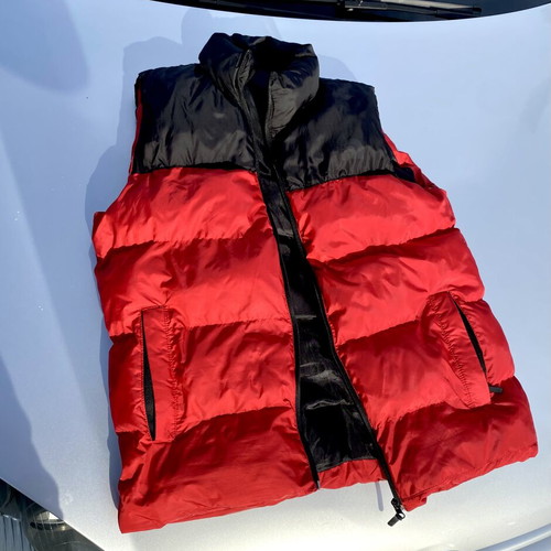 The North Face red and black puffer vest used, size M