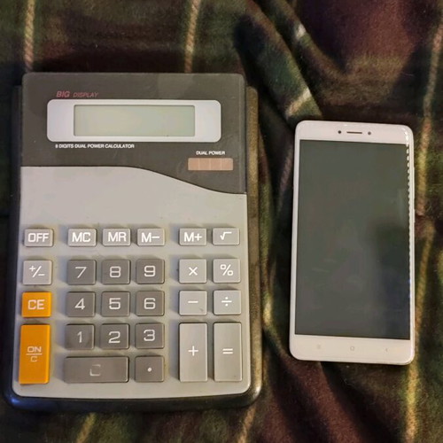 Large calculator used, size 20x15.5 cm