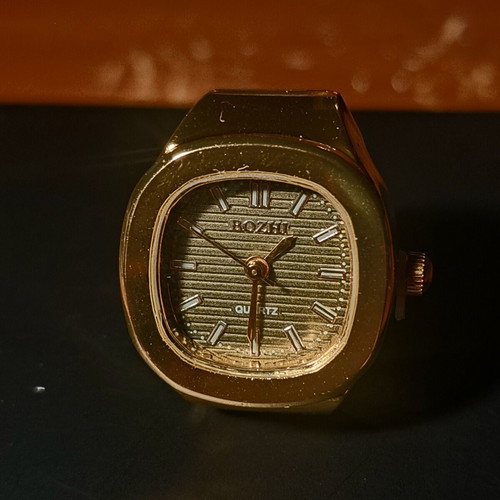 Ring watch with khaki dial and gold bracelet
