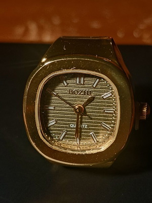Ring watch with khaki dial and gold bracelet