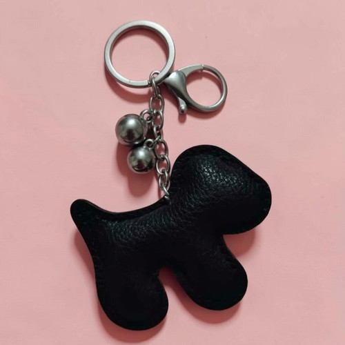 Dog-shaped keychain like new, black and silver
