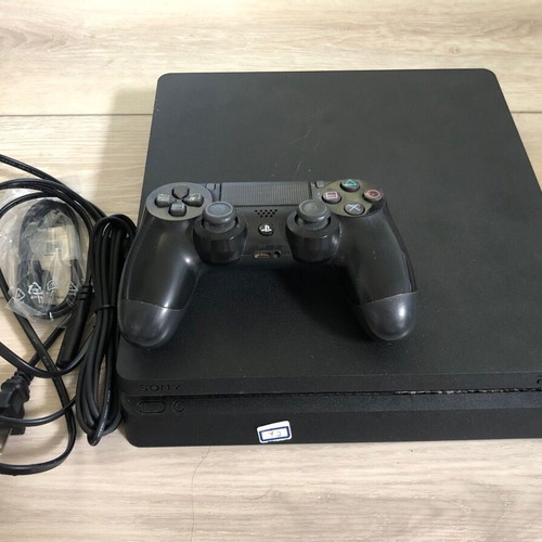 PlayStation 4 Slim console like new with cables and controller