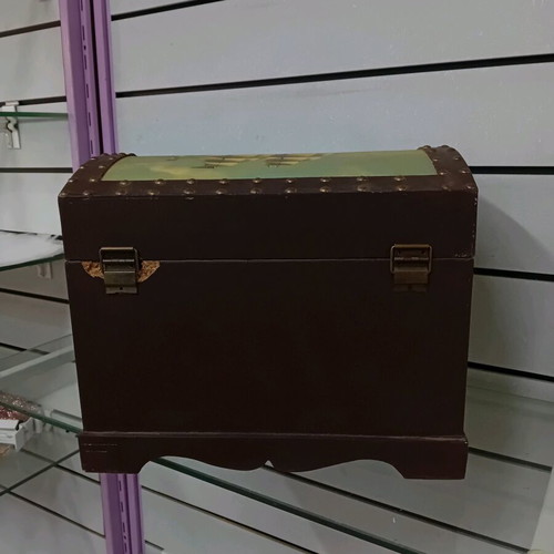 Small trunk used with ship decor and leather handles