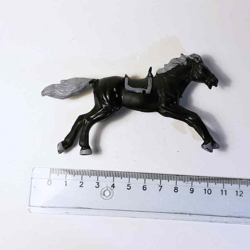 Plastic horse toy used with scratches and marks