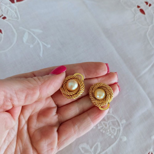 Vintage clip-on earrings used with gold embossed design and white pearl