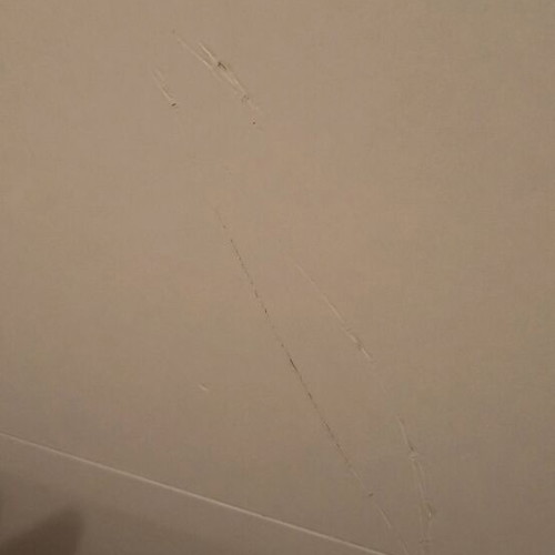 White bed headboard used with scratch