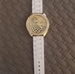 Women's wristwatch with rhinestones, white plastic strap