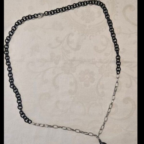 Modern necklace with black chain and angel wing pendant with rhinestones