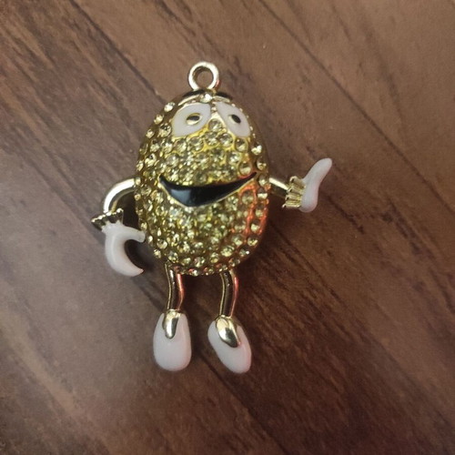 The Smiling Child pendant necklace like new, gold with white enamel