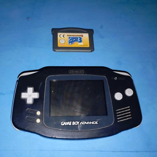 Nintendo Game Boy Advance console with Super Mario 3 cartridge