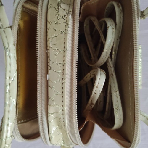 Small gold wristlet shoulder bag