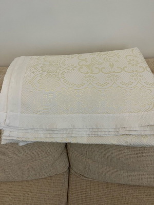 Throw blanket new, ecru with embossed design and gold details