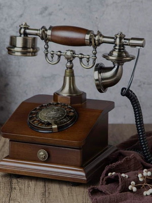 Retro analog telephone with dial new, metal and wood