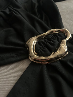 Black halter top with gold detail and open back