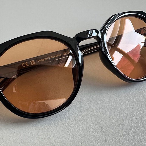 Meller Sunglasses new, black frame with yellow lenses