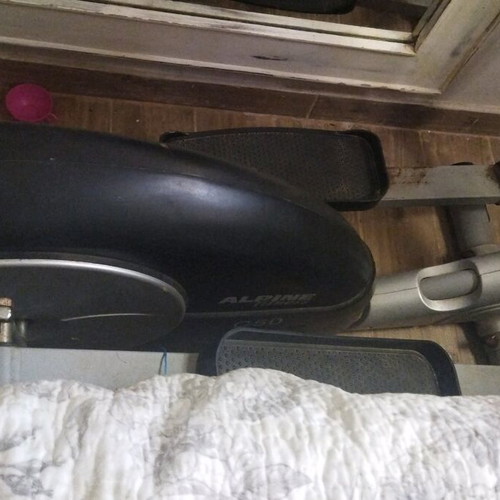 Elliptical machine used for full body fitness and exercise