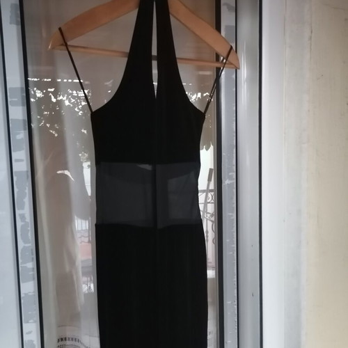 Black velvet jumpsuit with sheer mesh panel, halter neck