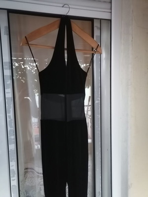 Black velvet jumpsuit with sheer mesh panel, halter neck