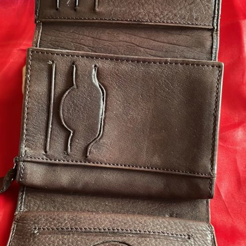 Brown leather wallet used with multiple compartments