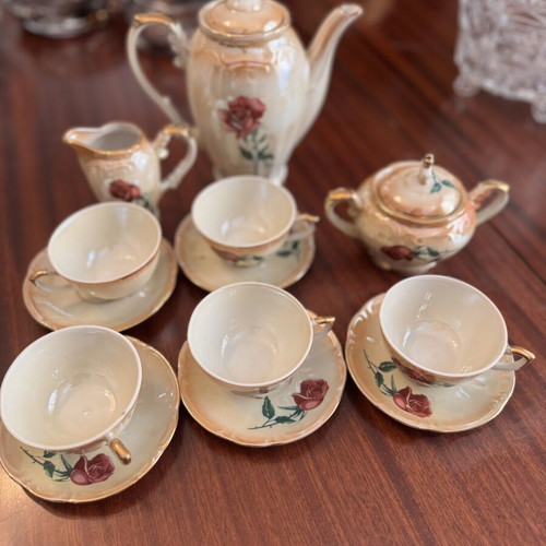 Vintage porcelain tea set with flowers and gold details, like new