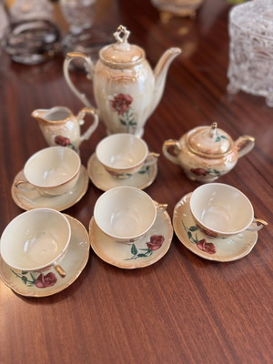 Vintage porcelain tea set with flowers and gold details, like new