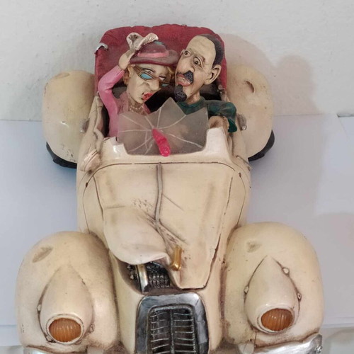 Ceramic funny money box, 25 cm length, funny couple in car, like new