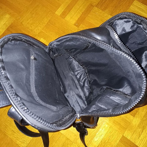 Backpack black leather type used with multiple pockets