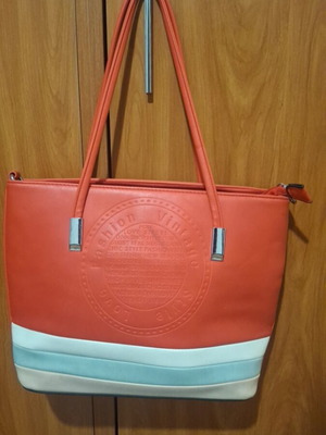 Red shoulder bag used with multiple compartments and zippers