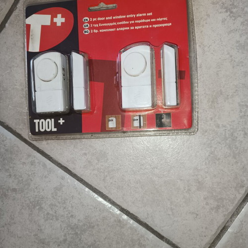 Security package used with ceiling motion alarm, door & window entry alarm, and realistic security camera