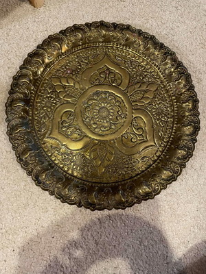 Decorative metal plate used with embossed design